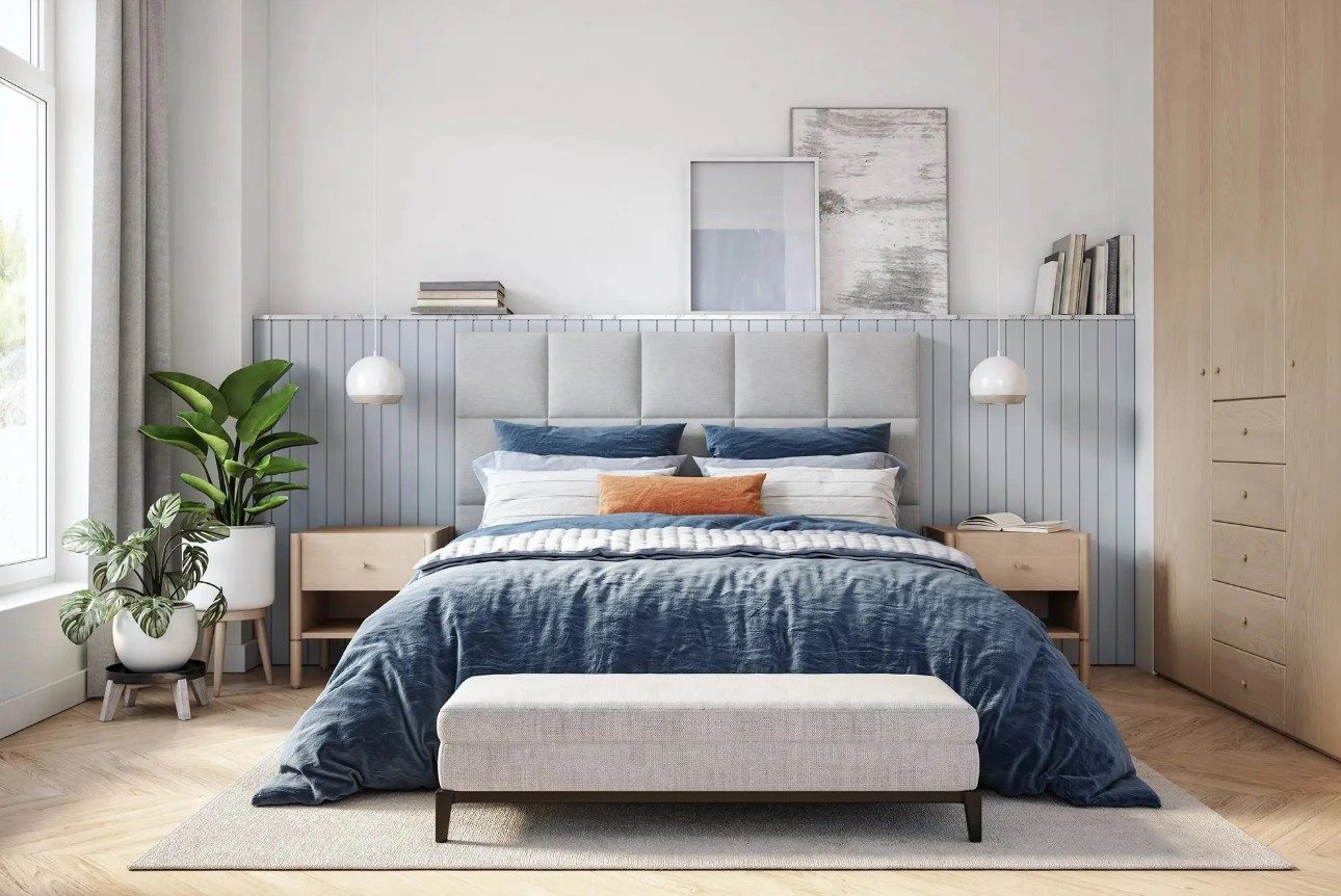 Neatly made bed in a guest-ready bedroom